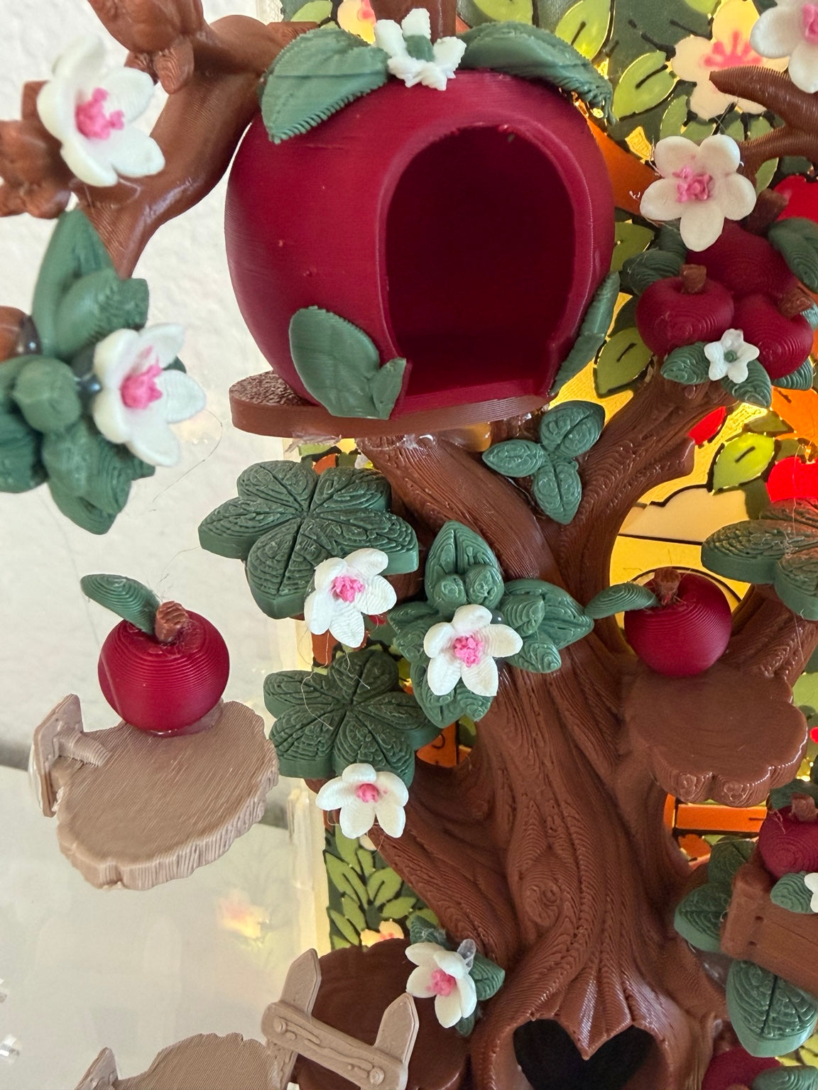 Cobbler's Orchard apple hide, blossoms, leaves, and perch detail