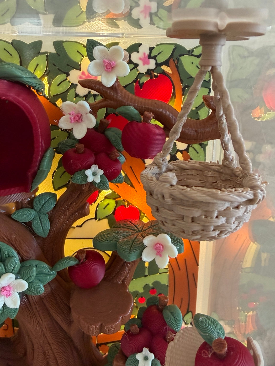 Cobbler's Orchard hanging basket, apples, blossoms, and climbing branch detail